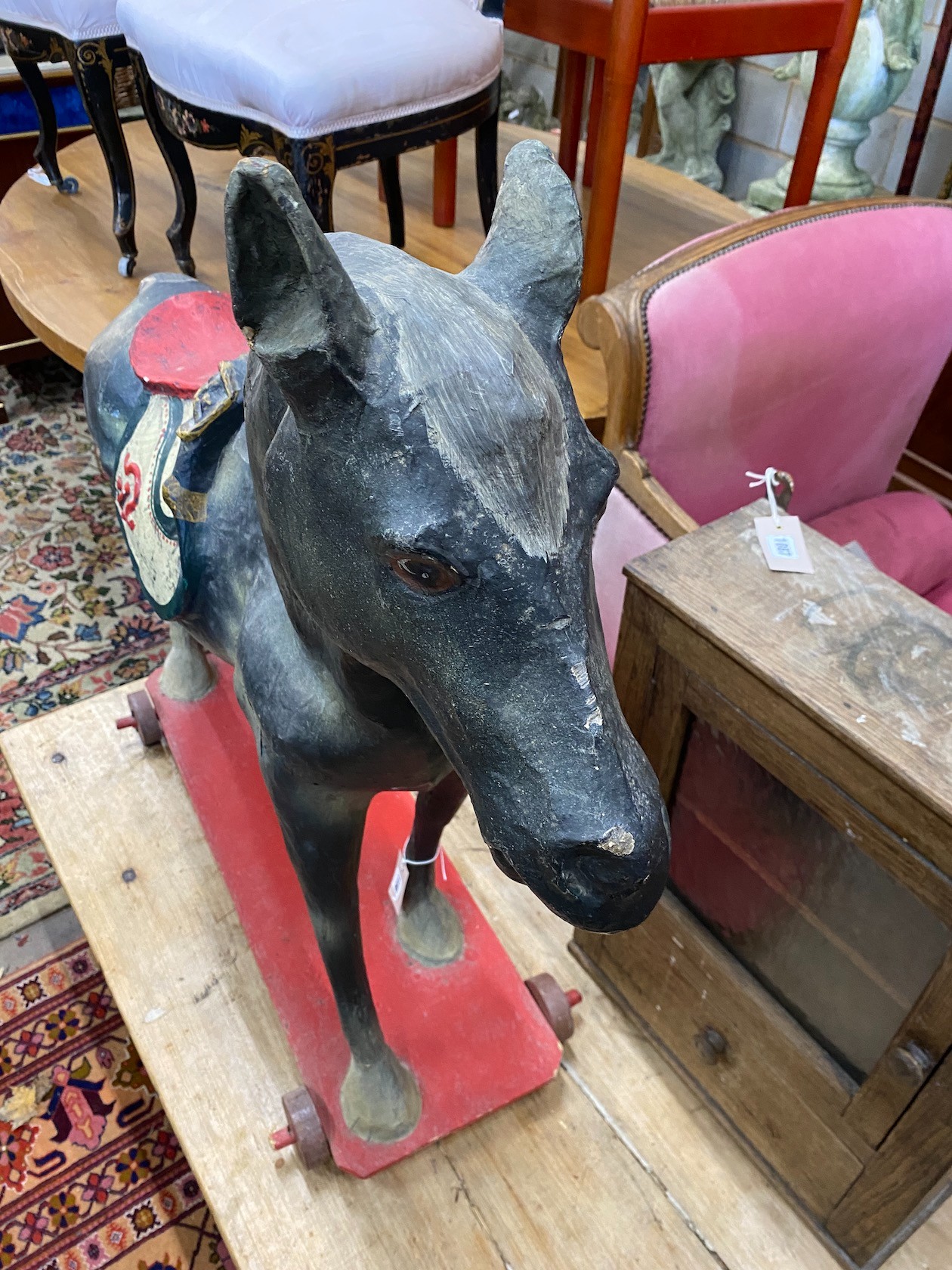 A 1930's German moulded and painted composition pull-along horse, height 96cm